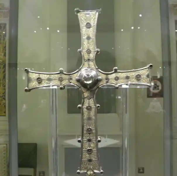 A Christian cross with dots and mini-cross design